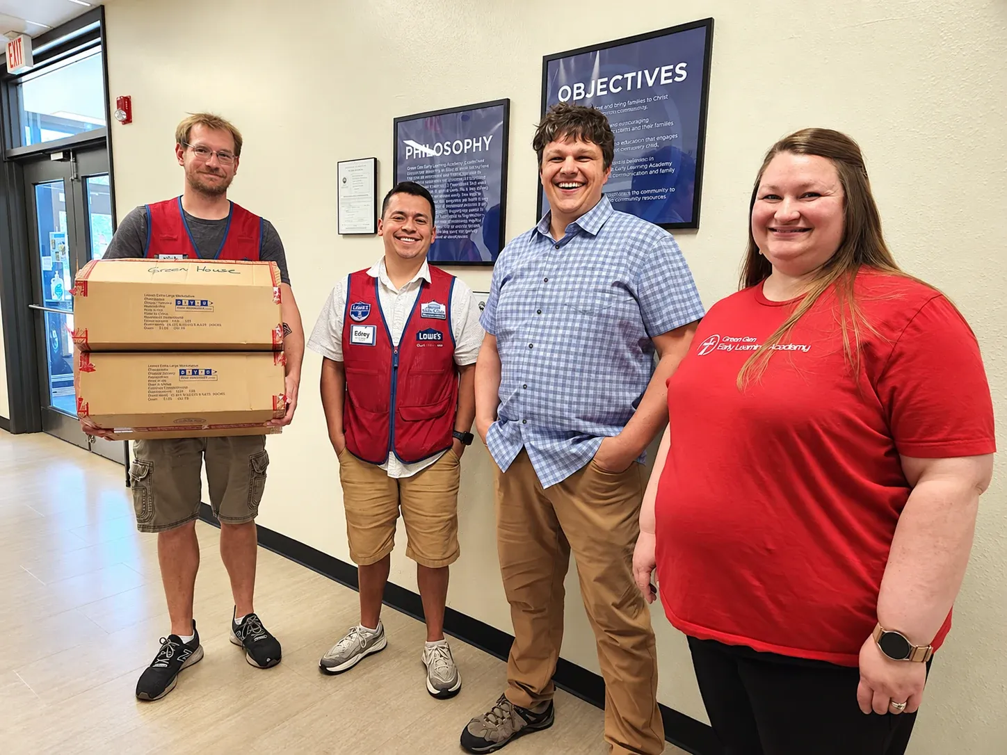 Lowe's team members deliver a donation to Chapel Glen ELA staff