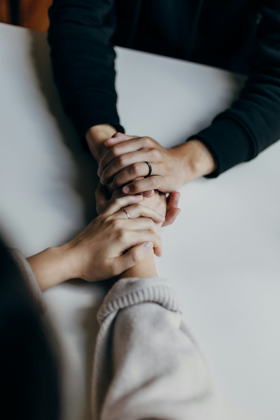 Hands joined together in care and prayer