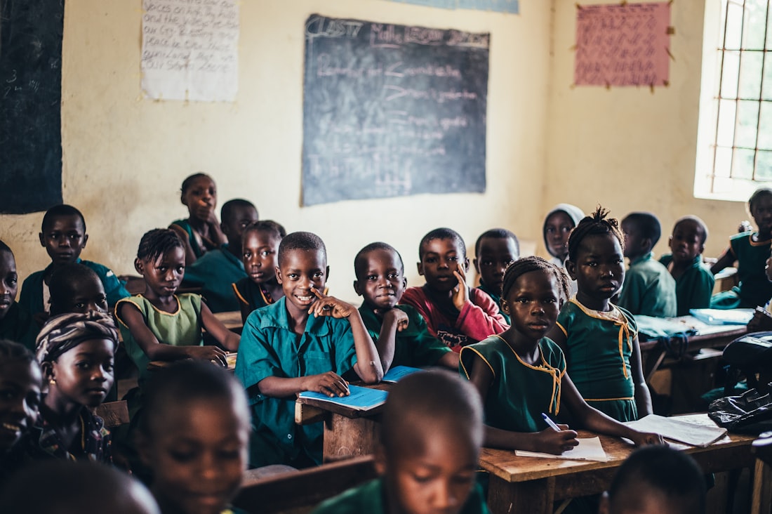 Teachers and children together in a warm classroom